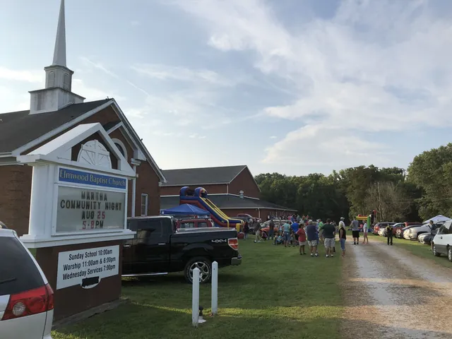 Neighbors gathered on the lawn outside Elmwood Baptist Church